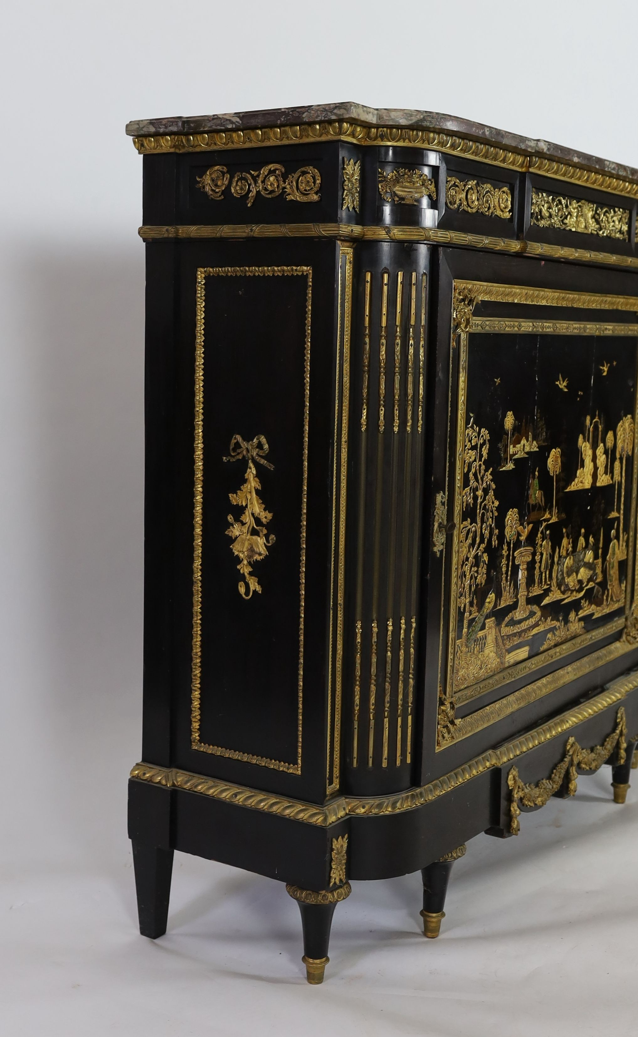 A 19th century French Louis XVI style ormolu mounted ebonised side cabinet, W.134cm D.46cm H.122cm
